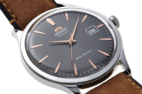 Bambino Youth SAC08003A0. A grey dial automatic dress watch of 42mm case size, red tipped seconds hand and fitted with a color lined brown leather strap. Shop now on orientwatch.in